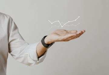 digital-graph-with-businessman-hand-overlay